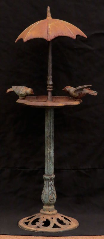 Small Cast Iron Bird Bath with Umbrella. Unsigned.: Small Cast Iron Bird Bath with Umbrella. Unsigned. Rusting and a Little Corrosion or else Good Condition. Measures 30 Inches Tall and Base Measures 8-1/2 Inches Diameter. We will not ship this item du