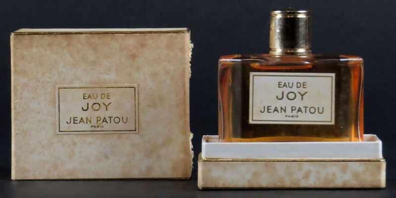 Vintage Eau de Joy Jean Patou Perfume in Original Box.: Vintage Eau de Joy Jean Patou Perfume in Original Box. Box Has Been Opened but I doubt the Perfume Was. Measures 3 Inches Tall and 3 Inches Wide. We Will Not Ship This Item In-House Due to Postal Regu