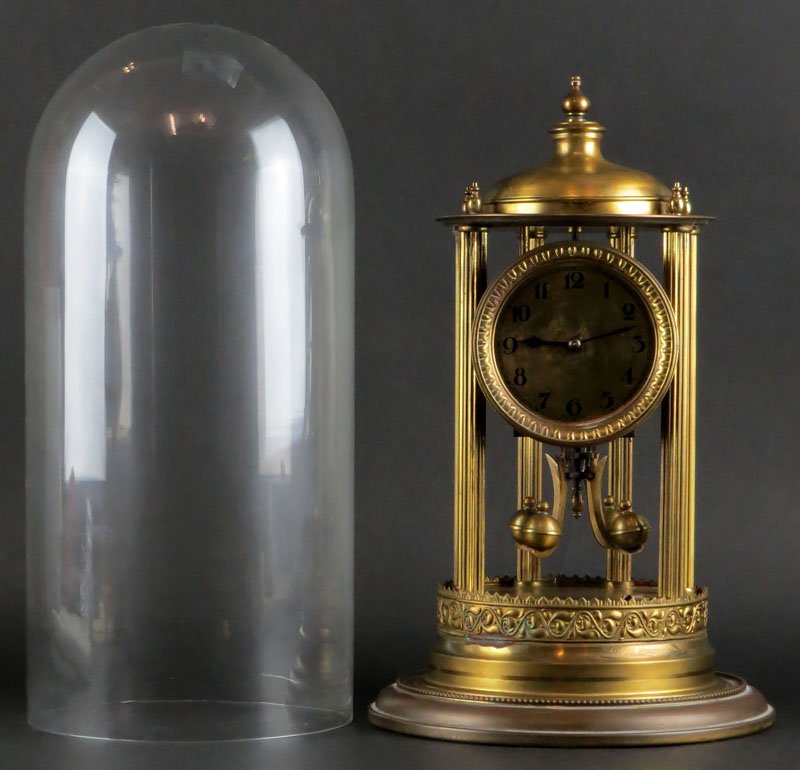 Old Anniversary Clock Under Glass Dome. Signed: Old Anniversary Clock Under Glass Dome. Signed Specialty Trading Company Germany. Good Condition. Not Currently Running. Measures 17 Inches to Top of Dome. Shipping $76.00