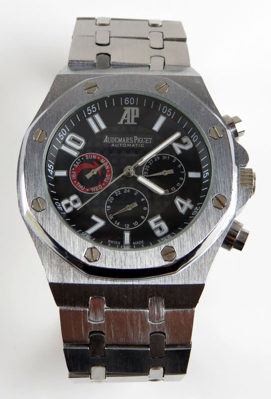 Audemars Piguet Replica Wristwatch with Silvertone: Audemars Piguet Replica Wristwatch with Silvertone Band. Bears Audemars Piguet Signature. Good Condition. Shipping $20.00