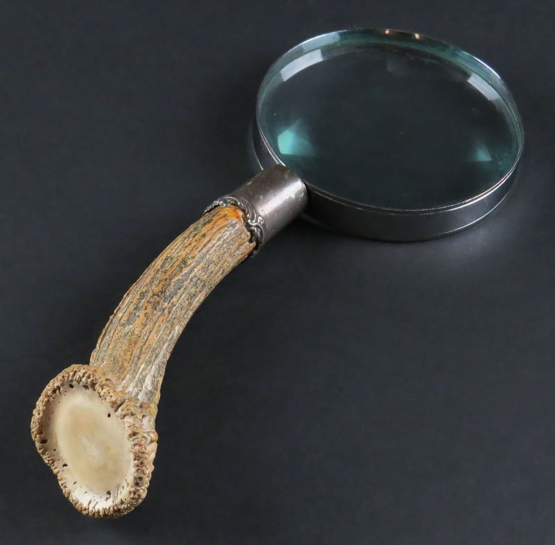 Deer Horn Magnifying Glass with Sterling Silver Collar.: Deer Horn Magnifying Glass with Sterling Silver Collar. Signed Sterling. Rim to Magnifying Glass Slightly Out of Round or else Good Condition. Measures 9-1/4 Inches Tall. Shipping $20.00