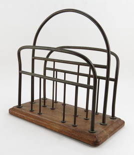 John Walsh English Wood and Brass Magazine Rack. Signed: John Walsh English Wood and Brass Magazine Rack. Signed Brass Plaque Under Base. Good Condition. Measures 13-3/4 Inches by 14 Inches. Shipping $40.00