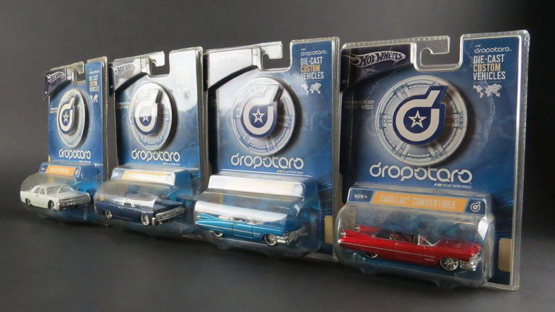 Four (4) Hot Wheels Die-Cast Custom Vehicles In: Four (4) Hot Wheels Die-Cast Custom Vehicles In Original Packaging. Signed. Good Condition. Measures 6 Inches Tall and 4 Inches Long. Shipping $20.00