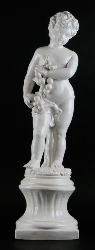 White Ceramic Figure of Boy Holding  Branch Of Grapes. (1 of 1)