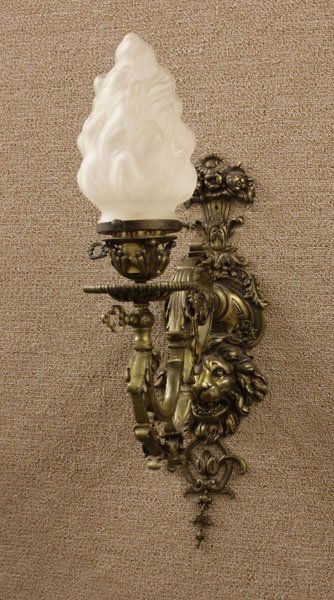 Mid-Century Brass Wall Sconce with Lion Motif: Mid-Century Brass Wall Sconce with Lion Motif and Frosted Glass Shade. Electrified. Wear to Finish or else Good Condition. Measures Approx. 19" H by 6" W. Shipping $40.00
