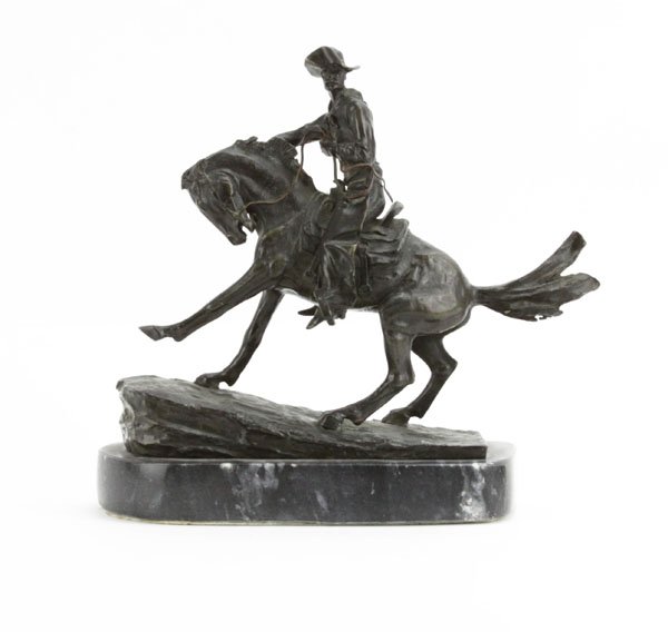 Frederic Remington Bronze Sculpture of "The Cowboy" on: Frederic Remington Bronze Sculpture of "The Cowboy" on Marble Base. Good Condition. Measures 10-1/2" H by 11" W. Shipping $45.00