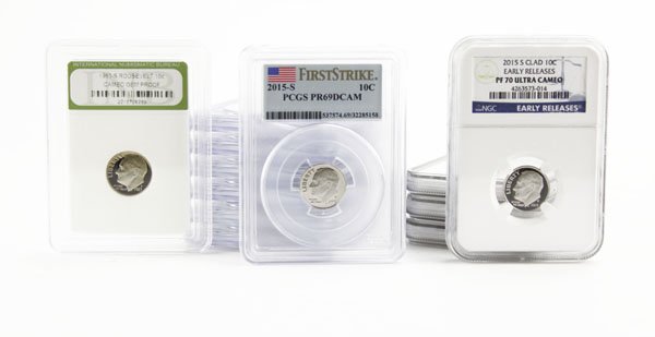 Lot of Twelve (12) Collector's Dimes Encased in Plastic: Lot of Twelve (12) Collector's Dimes Encased in Plastic. Includes Ultra Cameo and First Strike. Includes Years 1983, 2002, 2008, and 2015. Measures 3-1/4" H by 2-1/2" W. These Coins ARE NOT Profession