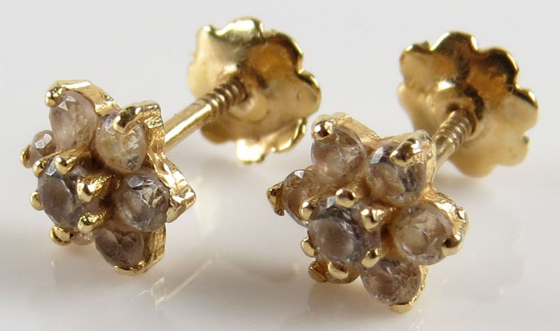 Pair of Children's 14 Karat Yellow Gold and Diamond: Pair of Children's 14 Karat Yellow Gold and Diamond Screwback Earrings. Unsigned. Good Condition. Gross Weighs 0.5 Pennyweights. Shipping $20.00