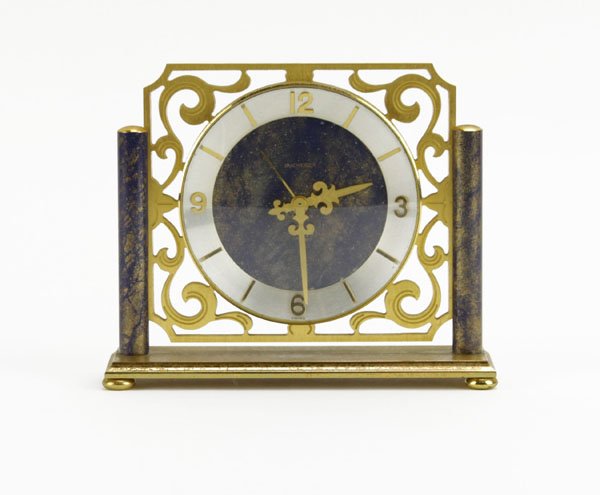 Bucherer Brass Desk Clock. Wear to Metal. Measures 4-1/: Bucherer Brass Desk Clock. Wear to Metal. Measures 4-1/4" H by 5" W. Shipping $20.00