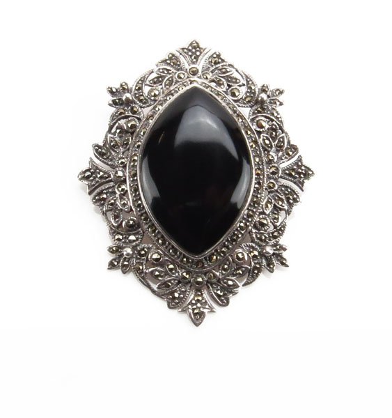 Sterling Silver Marcasite and Onyx Pin/Pendant. Unsigne: Sterling Silver Marcasite and Onyx Pin/Pendant. Unsigned, Tested. Measures 1-3/4" H by 2" Across. Shipping $20.00