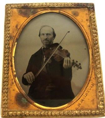 Ambrotype MAN PLAYING VIOLIN McIntosh: Ambrotype of man playing violin by photographer R.M. McIntosh. Approx 2-1/2" x 1-1/2"