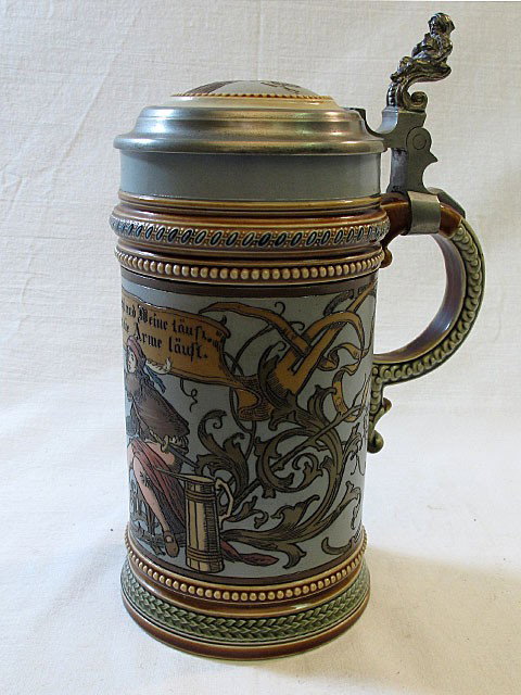 Incised Mettlach Stein #1947: Mettlach etched stein #1947. .5L, inlay lid of cat with fish. Man drinking with cat.