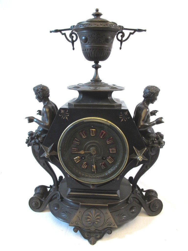 Pickard Rococo Bronze & Slate Figural Clock: French figural clock. Works signed Charles Pickard Paris. Slate body on bronze base with two male bronze satyr figure mounts topped by a bronze lidded urn. Unsigned bronze with excellent detail and ve