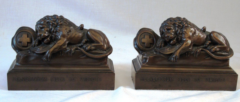 Bronzed Jennings Bros. Lion Bookends: Pair of Jennings Brothers lion bookends. 7 1/2" x 5" x 3". These are the Lions of Lucerne, after the Swiss statue commemorating the men who died defending Switzerland.