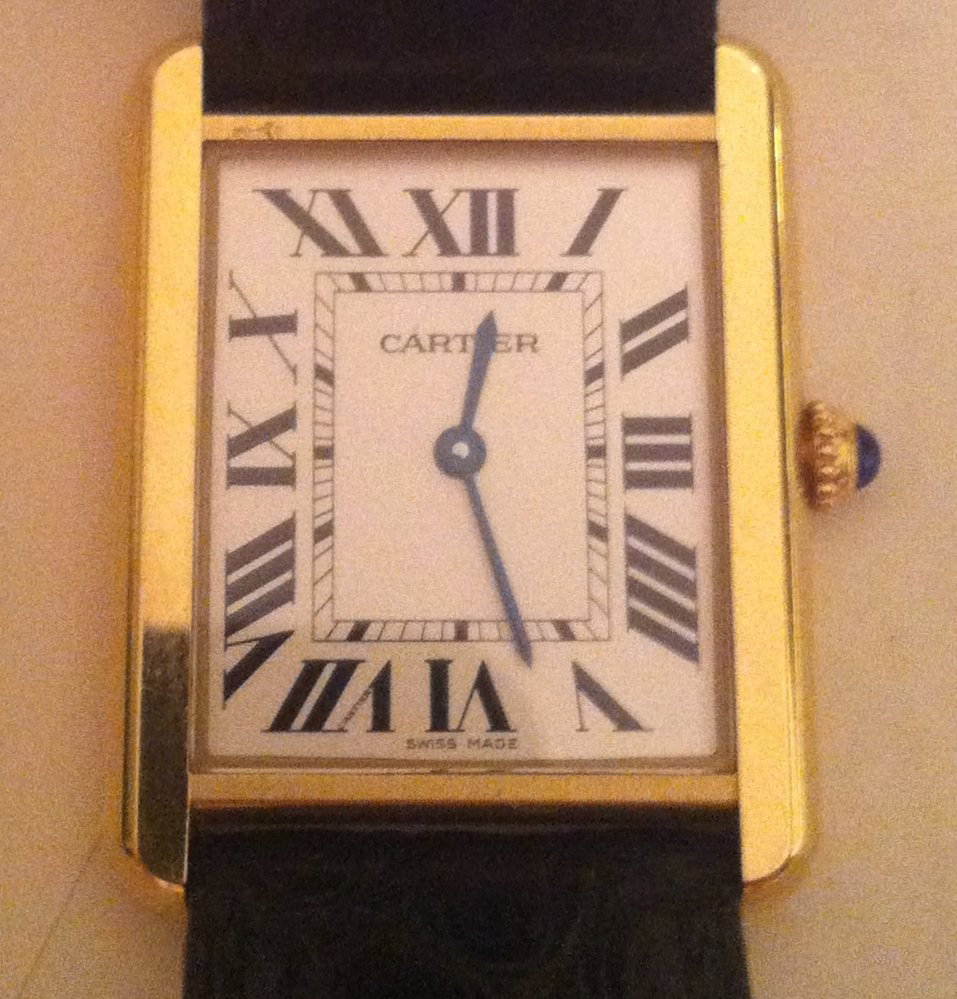 Cartier Tank Solo 18K Mens Watch: In original box with papers and outer box. Original leather band and 18K Cartier clasp.