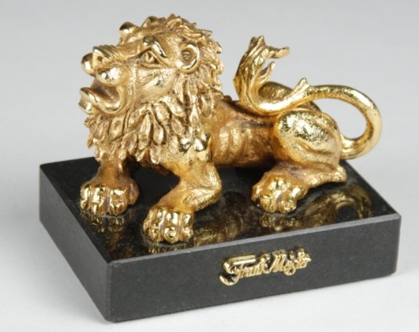 Israeli Sculptor Frank Meisler Bronze Lion: 3" x 3 5/8" mini lion. This gold plated metal sculpture created by Frank Meisler, is a royal lion with movable head, mounted on a marble base.