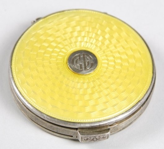 Tiffany & Co Sterling Enamel Guilloche Compact: Lovely Tiffany & Co. 1 1/2" yellow enamel on Sterling guilloche Art Deco compact. Contains nearly empty Coty powder.