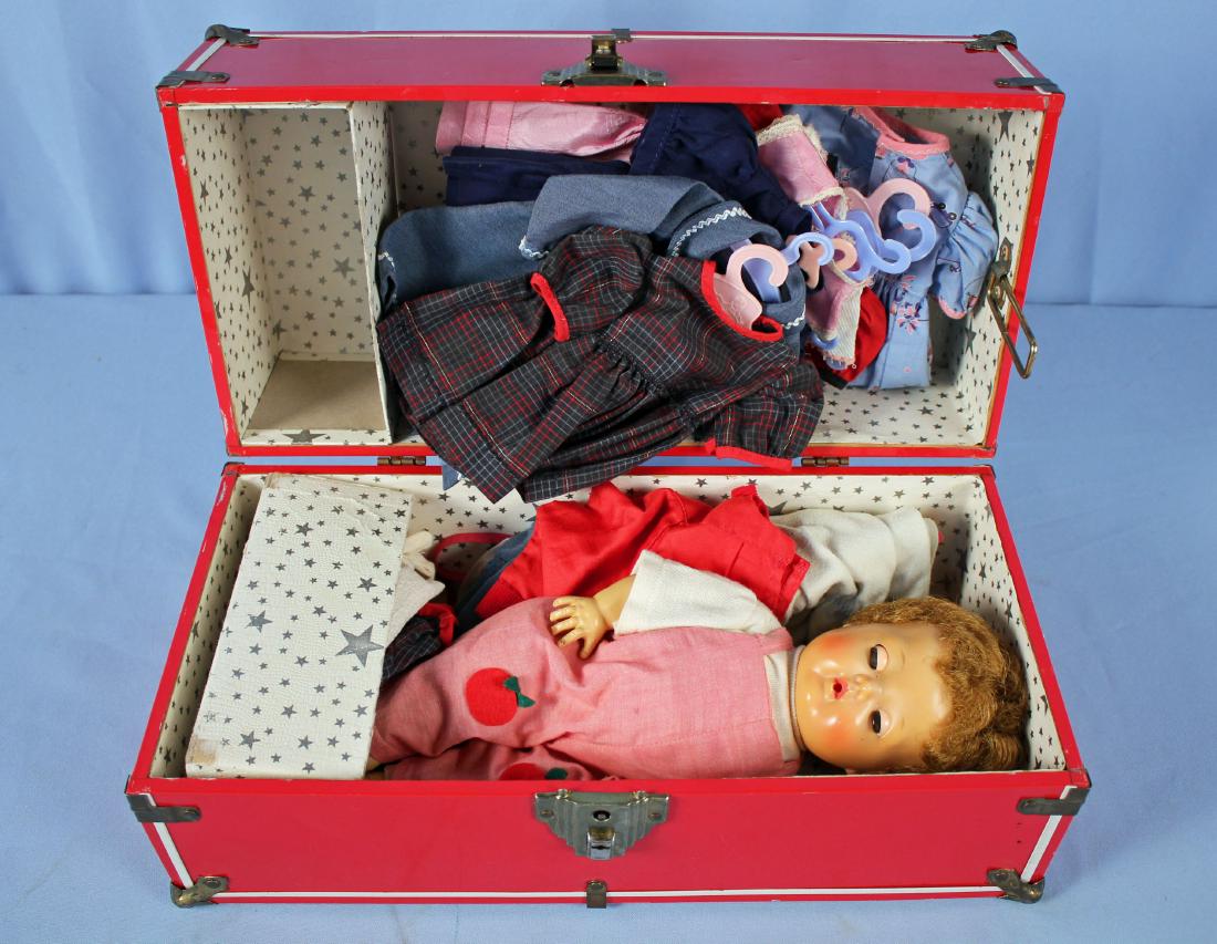 American Character "Tiny Tears" Doll w/ Suitcase: American Character "Tiny Tears" Doll w/ Suitcase. Cones with seven outfits on hangers and more (see photos). Doll measures approx. 13" long. Tin Suitcase measures 16" Long X 7.75" Wide X 8" High.