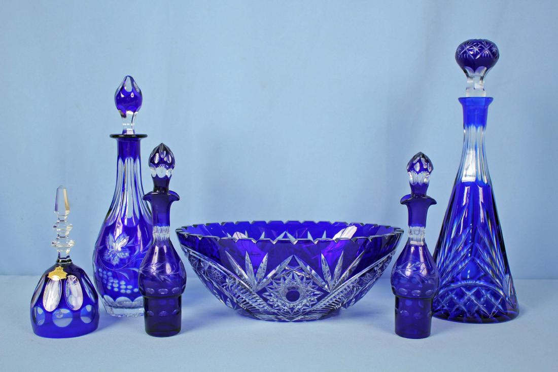 Group of West German Cobalt Cut To Clear Crystal: Group of West German Cobalt Cut To Clear Lead Crystal, (1) Bell 7" High (1) Center Bowl 4.5" High X 11.5" X 7.25" (1) Large wine bottle 14.5" High. (1) Liquor bottle 12.25" High. (2) Oil and vinegar b