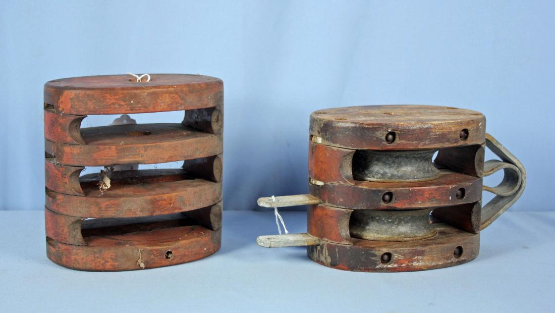 Two Large Wooden Pulleys: Two Large Wooden Pulleys. Pulleys measure 8" X 6 1/2" and 7 3/4" X 7 3/4".