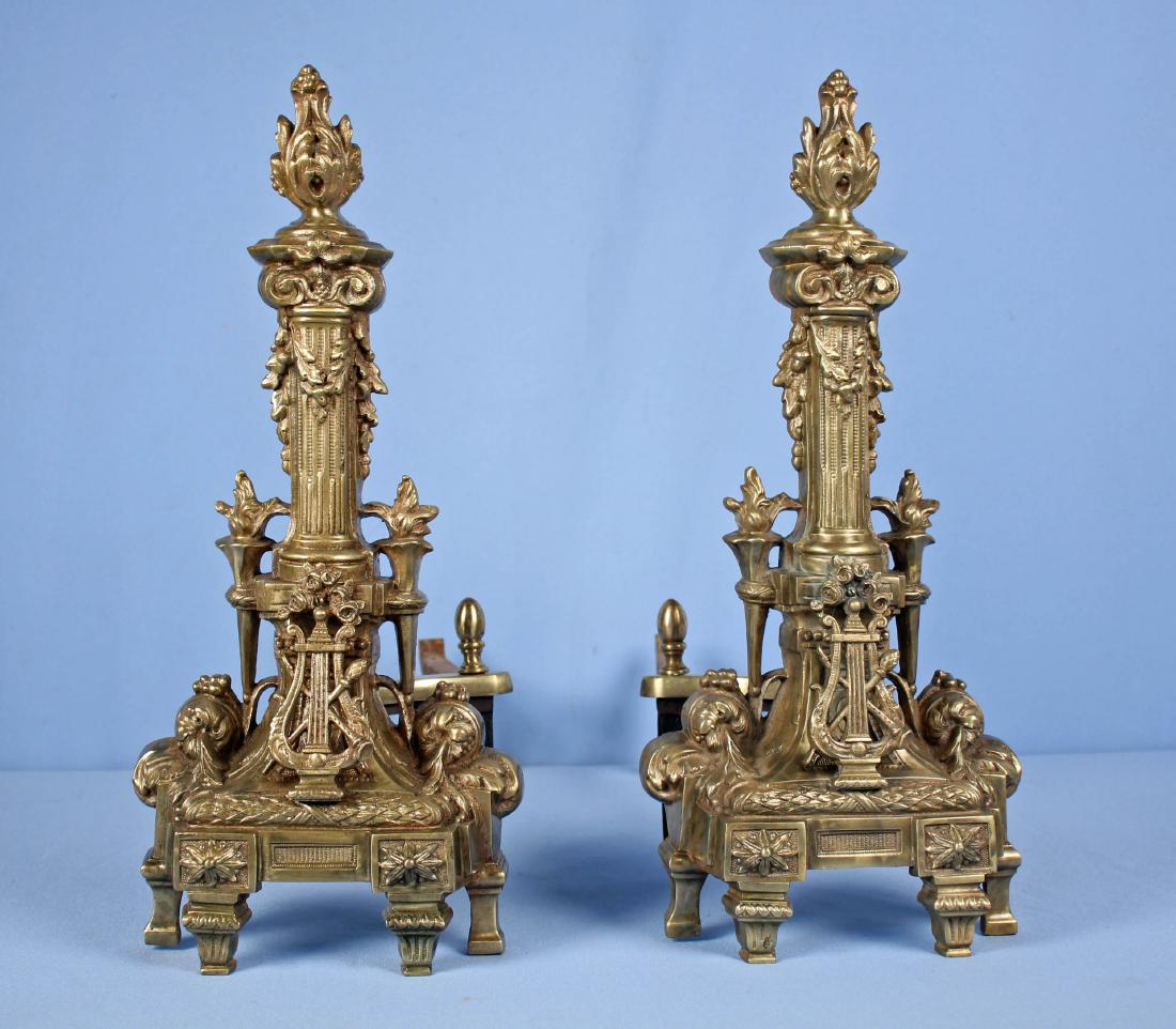 Pair Louis XVI Style French Andirons: Pair Brass Louis XVI Style French Andirons. 20th Century. 18" H x 8.25'" W x 20.5" D.
