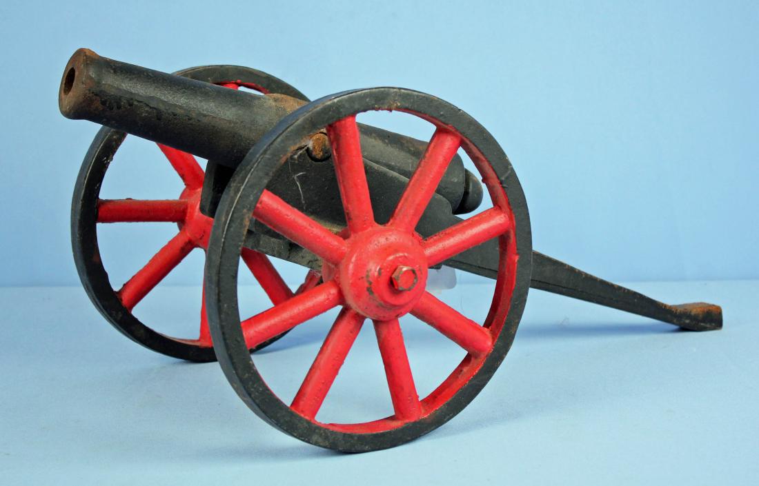 Old Cast Iron Signal Cannon: Old Cast Iron Signal Cannon. Cannon measures Approx. 25" Long and 12" Wide, barrel measures 14" Long, wheels are 10" Dia. Cannon weighs approx. 49 Lbs. and would be expensive to ship.