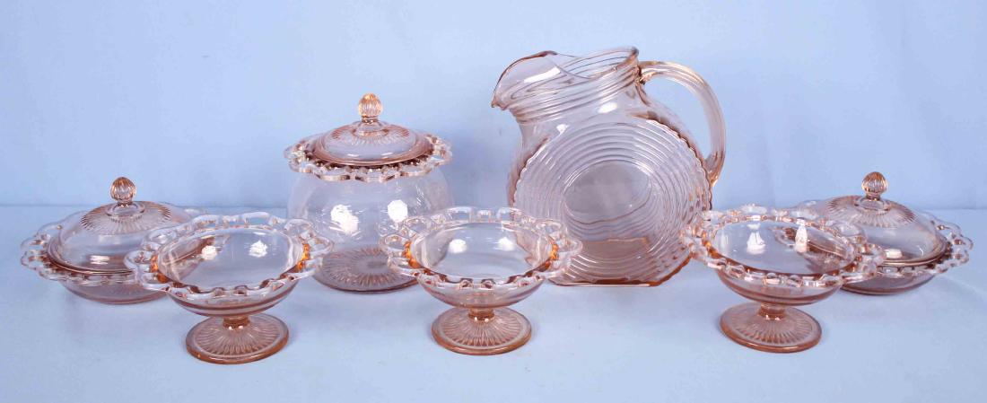 6 Pieces of Old Colony Open Lace Pink Depression: 6 Pieces of Old Colony Open Lace Pink Depression and One Art Deco Round Pitcher with Ice Lip. (3) 7" Footed open compotes. (2) Butter dishes with lids. (1) Cookie Jar with lid. (1) Art Deco round pitc