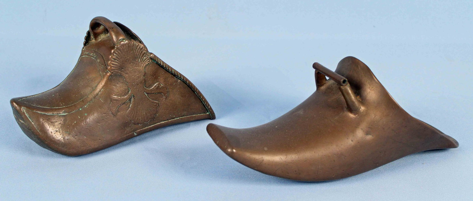 Two Spanish Colonial Conquistador Brass Stirrups: Two Antique Spanish Colonial Conquistador Brass Stirrups. Most likely they are 16th-17th century. Each stirrup has an old repair to it. (1) Stirrup measures 11 1/2" long x 4 5/8" wide x 4 3/4" high. (