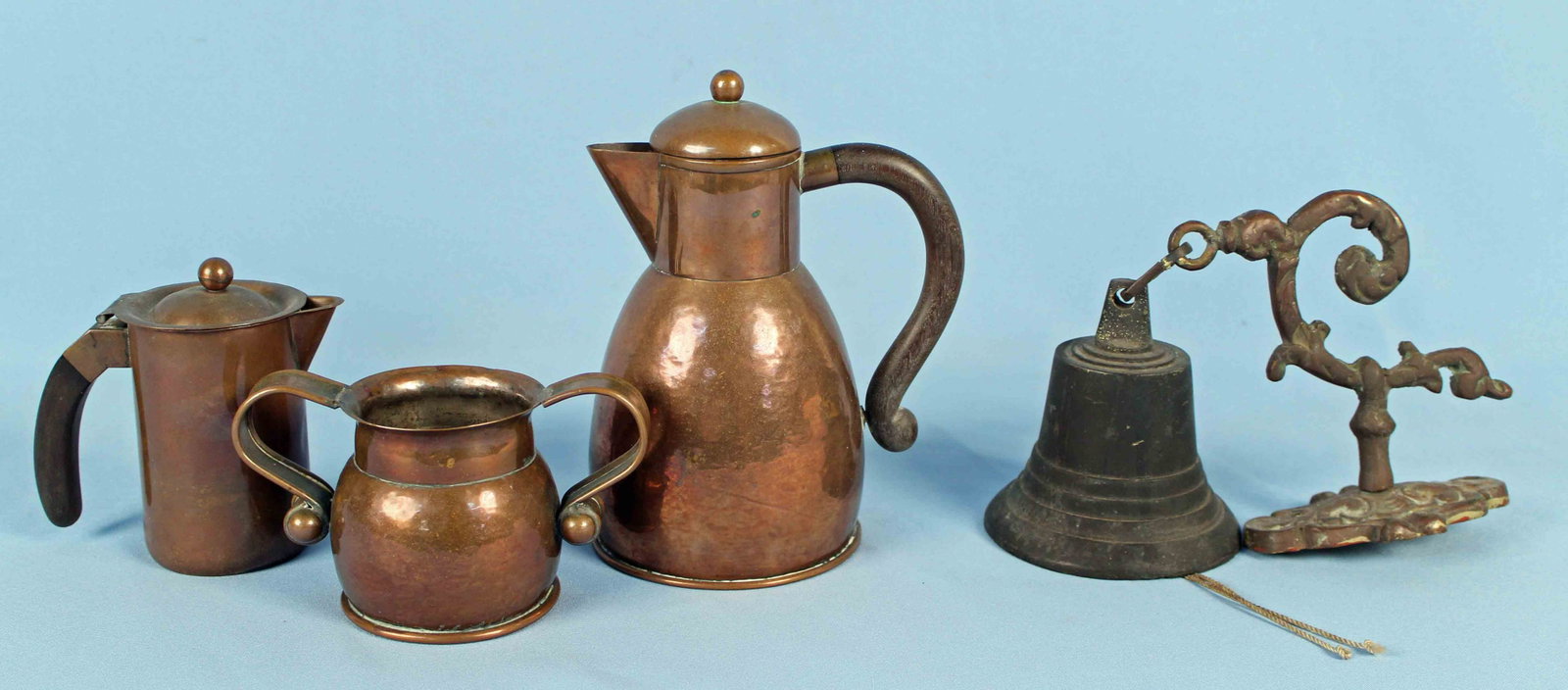 Taxco 3 Piece Copper Coffee Set & Brass Bell: Taxco Three Piece Copper Coffee Set and Brass Bell. All Taxco pieces are marked Taxco and Mexico on the bottom, probably 1930s. (1) Coffee pot with lid measures 8 1/4" high. (1) Creamer with lid measu