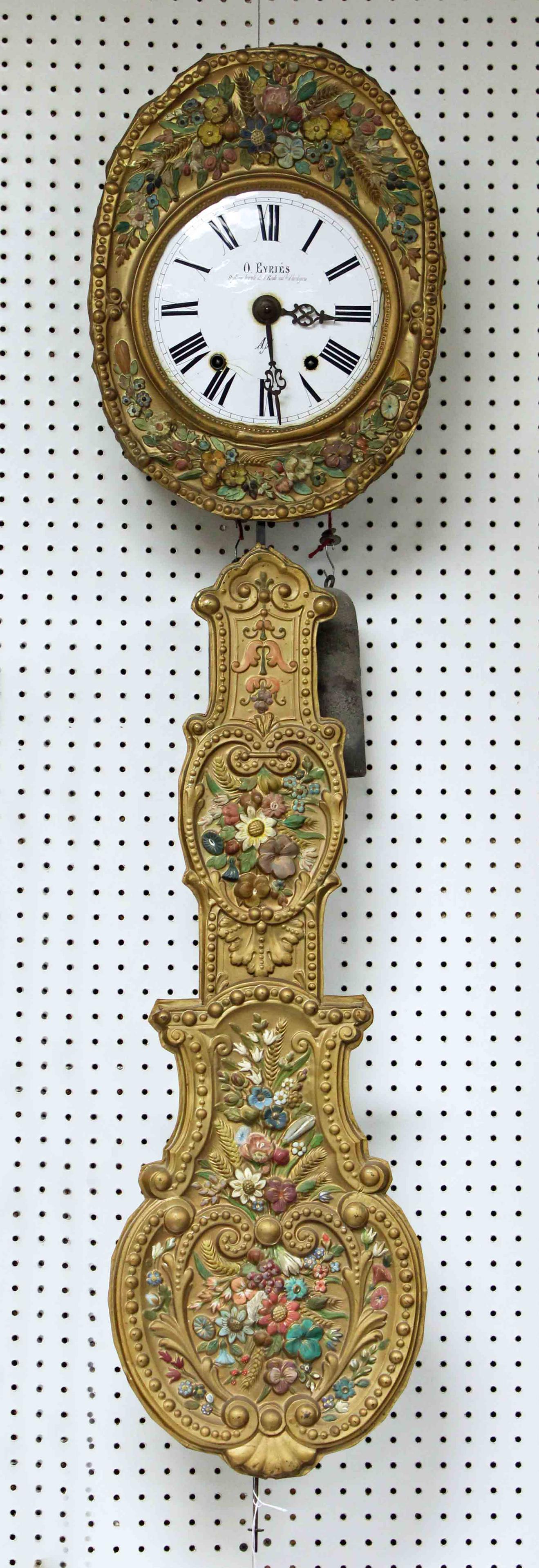French Brass O. Eyries Morbier Clock: French Brass Embossed Dial Signed "O. Eyries" Morbier Clock with Two Cast Iron Weights. Clock has been over painted with antique gold paint and polychromed flowers. Measures 57" long X 13 1/2" wide X 