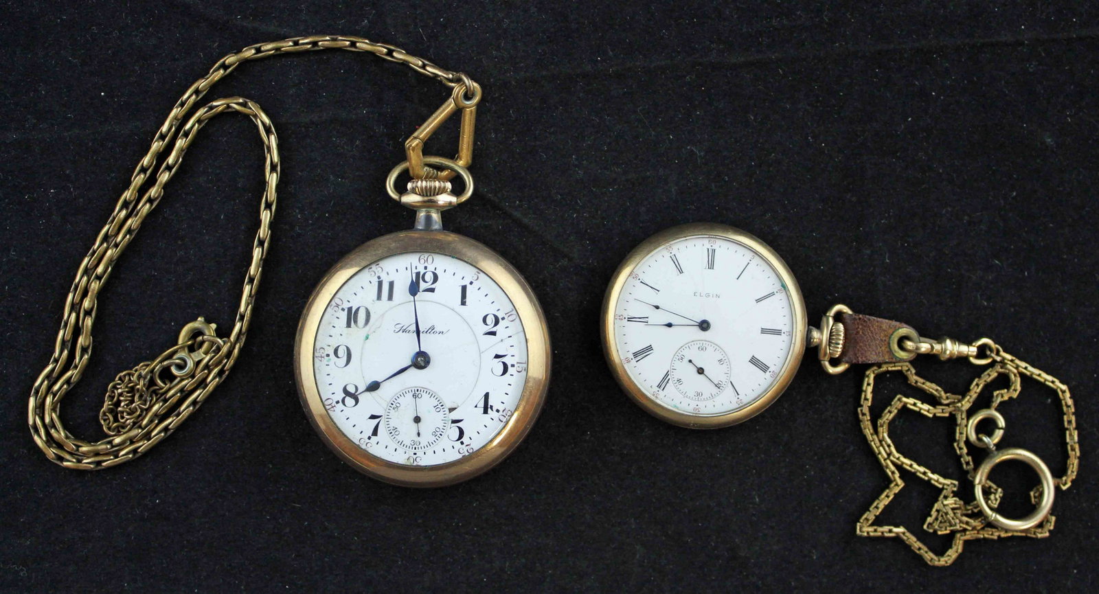 Two Antique Pocket Watches with Chains: Two Antique Pocket Watches with Chains. (1) Hamilton 21 Jewel open-face pocket-watch #598294, measures 54mm dia. Face has cracks, ran at inventory. (1) Elgin open face pocket-watch with Keystone 10kt 