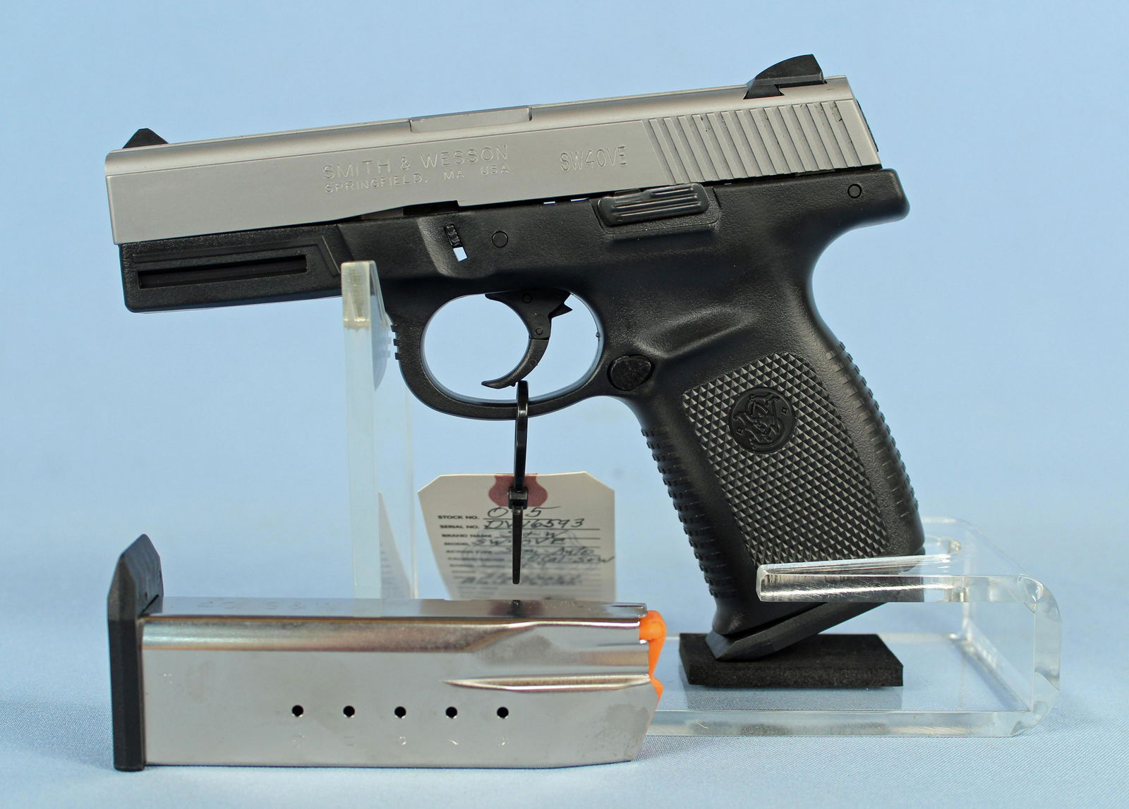 Smith & Wesson SW40VE Semi Auto .40 Cal S&W Pistol: Smith & Wesson SW40VE Semi Auto .40 Cal S&W Pistol. S#- DVN6593. Barrel measures 4". Pistol is constructed of stainless steel and black polymer. Pistol comes with two 14 round magazines, original box,