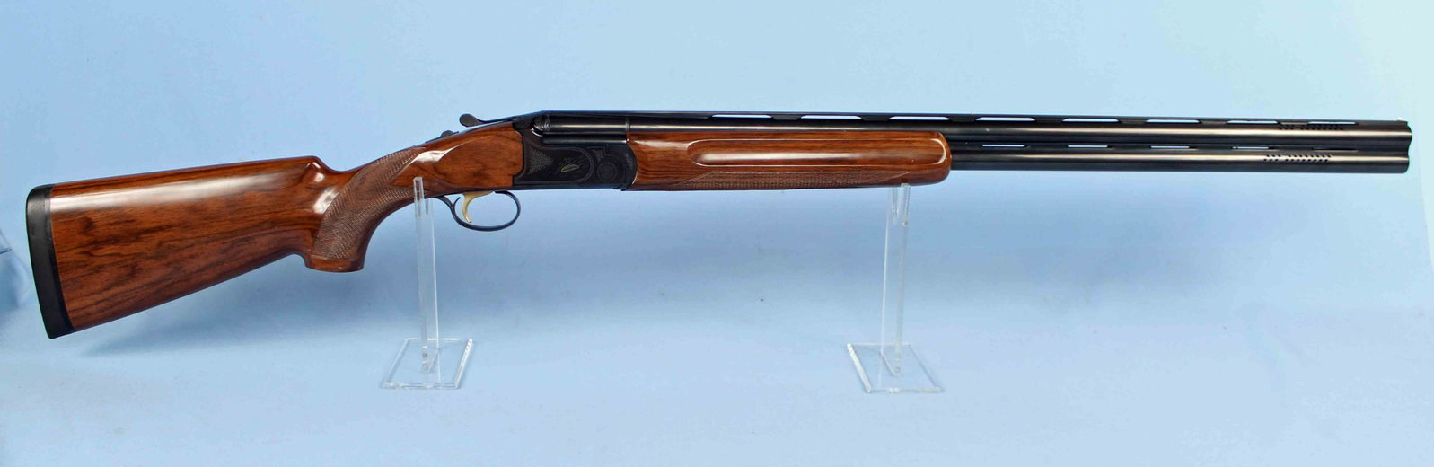 Churchill Windsor Sporting O&U 12 Ga. Shotgun: Churchill Windsor Sporting Over and Under 12 Ga. Shotgun. S#- CH95135. Barrel measures 30" long. Shotgun has 2 3/4"chambers, vented rib, engraved with clay pigeon, and has a gold trigger. READ OUR TER