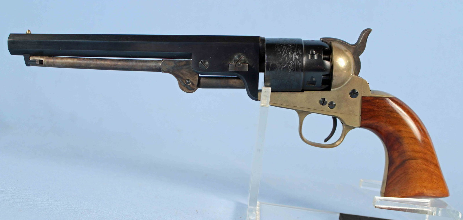 Colt Repro. 1851 Navy Single Action .44 Revolver: Colt Reproduction 1851 Navy Single Action .44 Cal Revolver. No serial number. Octagon barrel measures 7 1/2" long. Cylinder engraving depicts ships. READ OUR TERMS & CONDITIONS PRIOR TO BIDDING ON THI