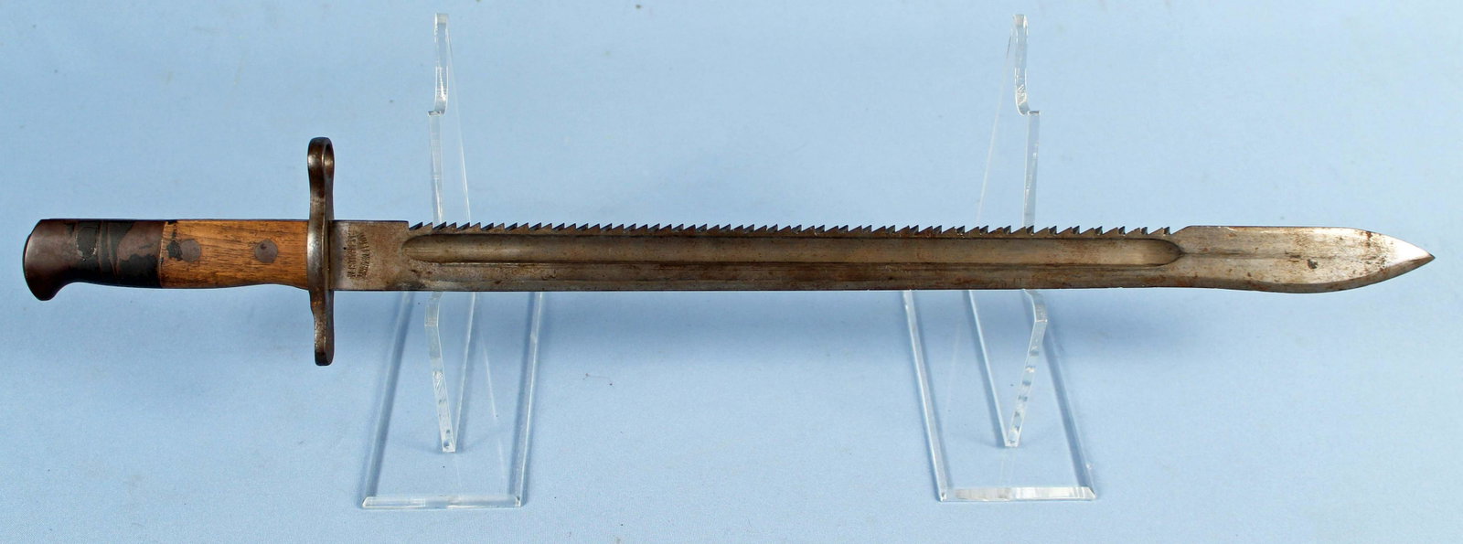 Swiss Sawback Bayonet: Swiss M11911 Sawback Bayonet, Waffenfabrik Neuhausen. Bayonet is marked, "Waffenfabrik Neuhausen," and has Swiss cross on cross guard. Sawback blade measures 18 7/8" long. Overall the bayonet measures