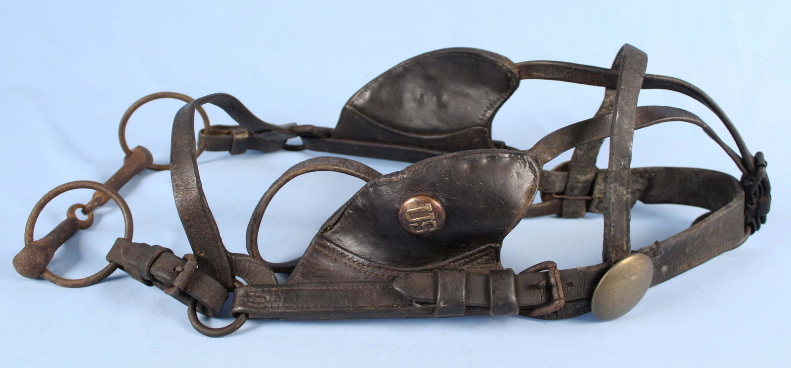 WWI Era US Army Horse Bridle: WWI Era US Army Horse Bridle. Condition- Bridle has some cracks to leather, tear by large rosette, etc. See photos.