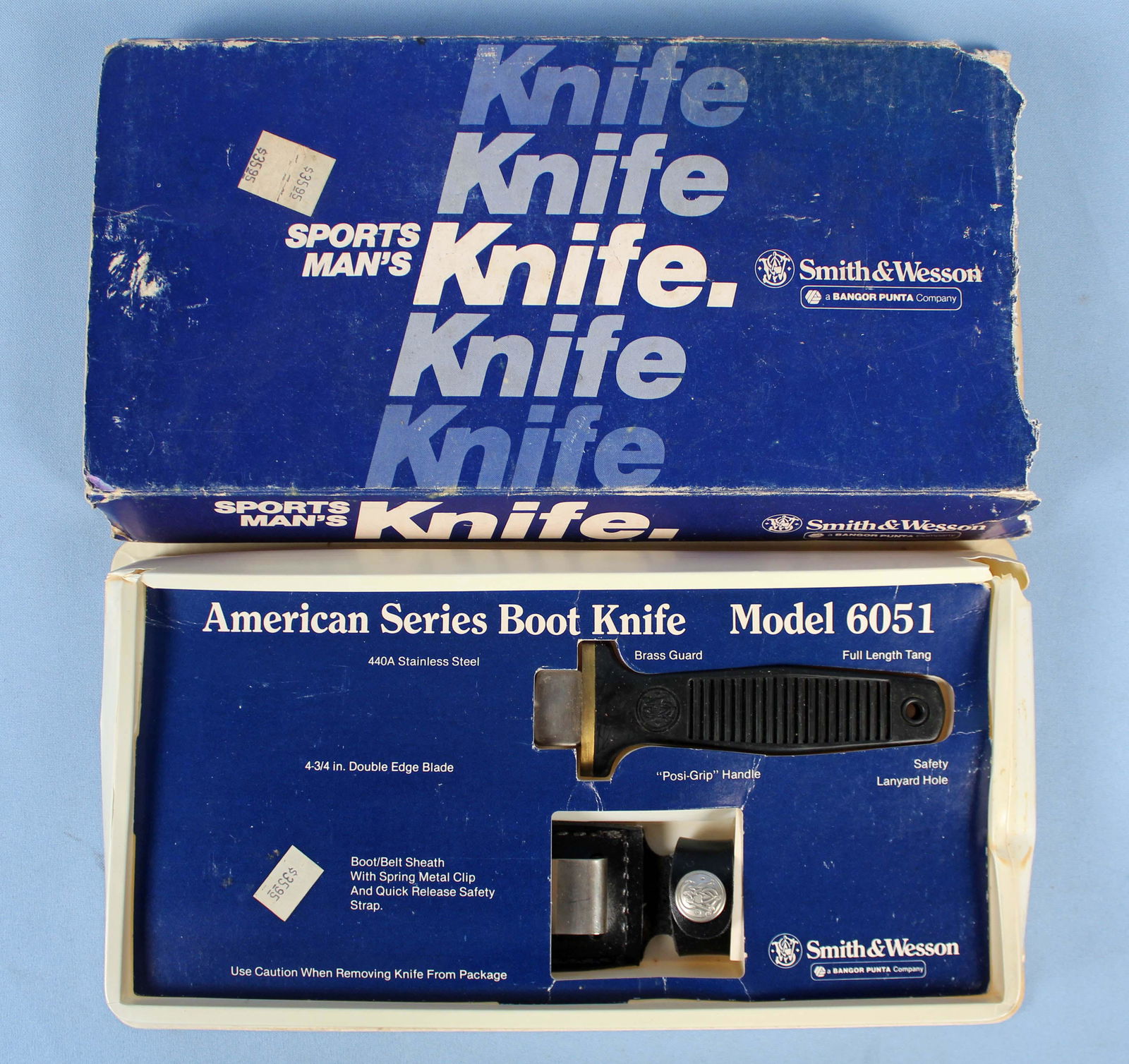 Smith & Wesson Model 6051 Boot Knife & Sheath: Smith & Wesson Model 6051 Boot Knife & Sheath. Original box, never used. Double edge 440 stainless steel blade measures 4 3\4" Long. Condition - Knife has never been used and is in the original box.