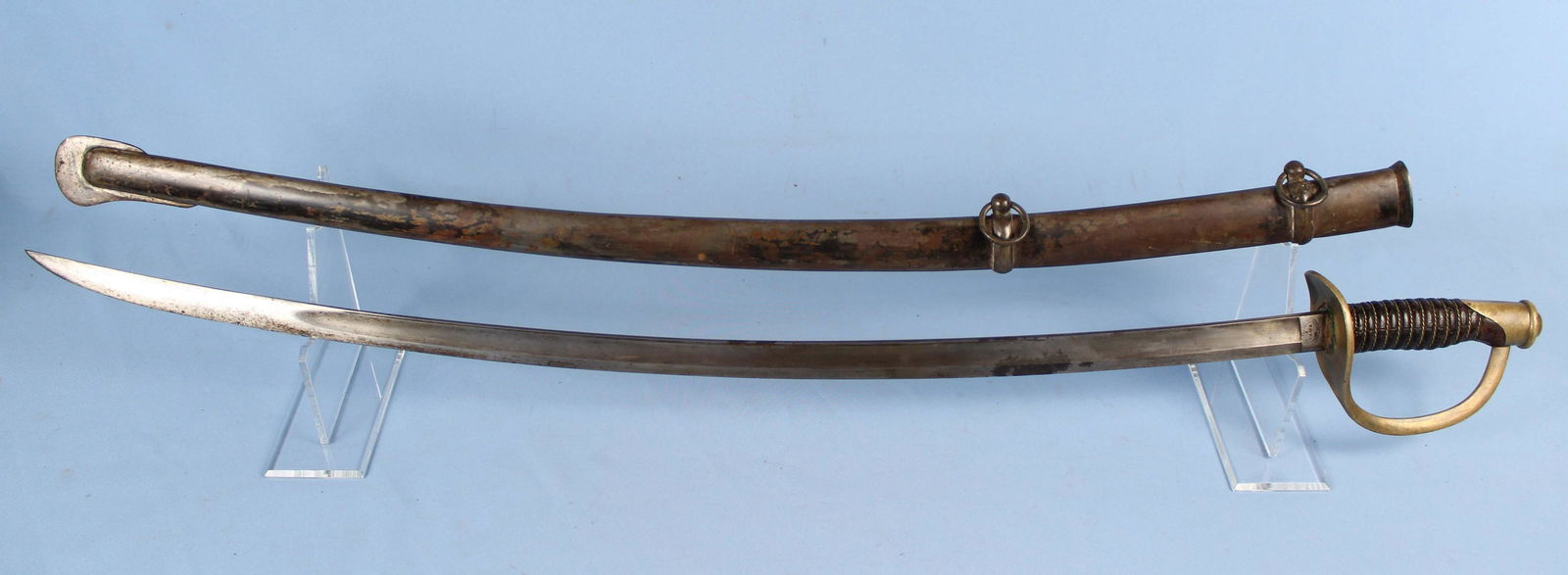 1864 Mansfield & Lamb US Calvary Sword & Scabbard: 1864 Mansfield & Lamb US Army Calvary Sword and Scabbard. Sword is marked, "U.S C.E.W 1864; Mansfield & Lamb Forestdale. R.I." Blade measures 35" long. Sword with scabbard measures 42 5/8" long. Condi