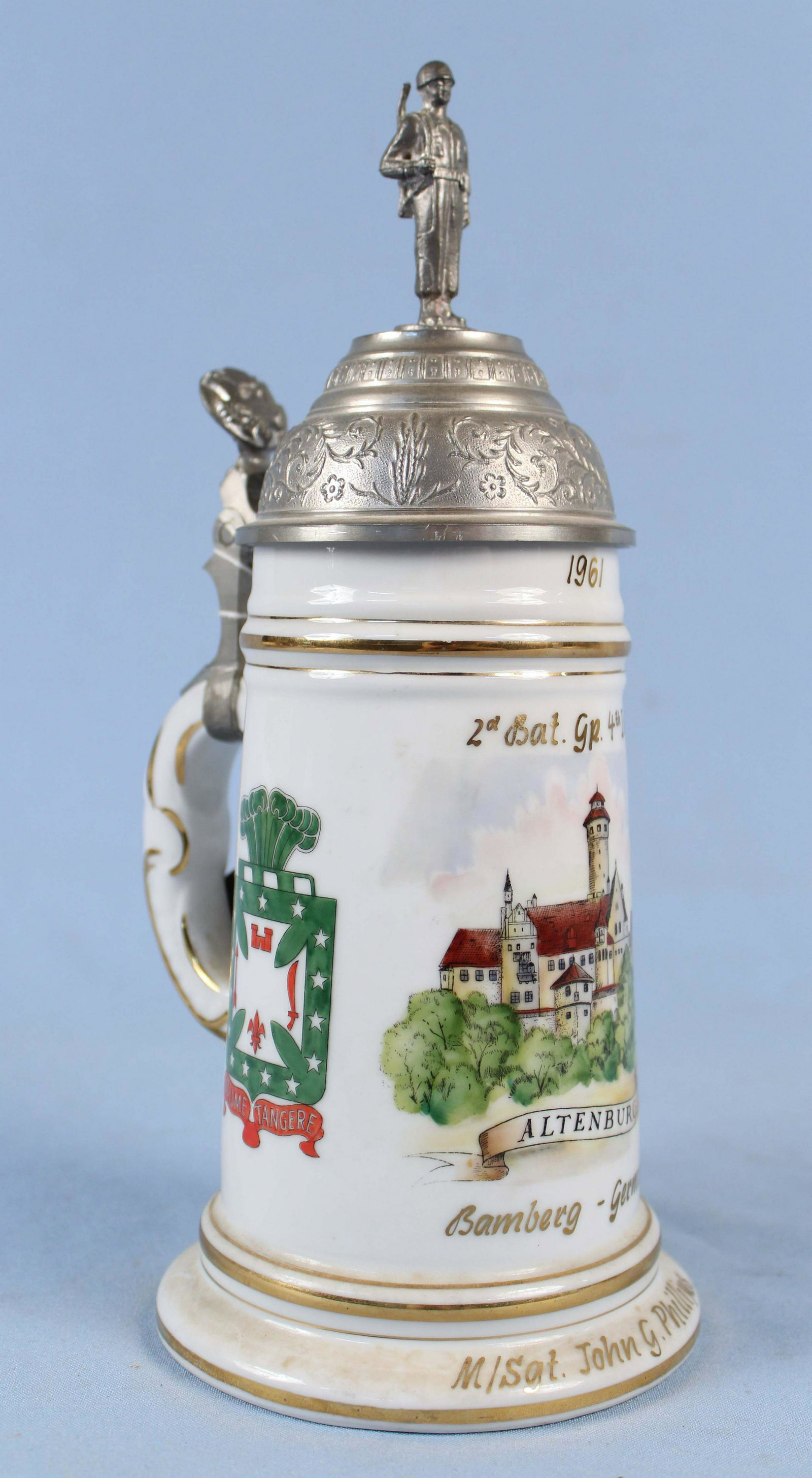 German US Regimental Beer Stein: German US Regimental Beer Stein with Lithophane of Couple Dancing at Bottom of Interior. Pewter top depicting solider and military seal. Stein was made to honor M/Sgt. John G. Phillips, 2nd Bat. GR. 4