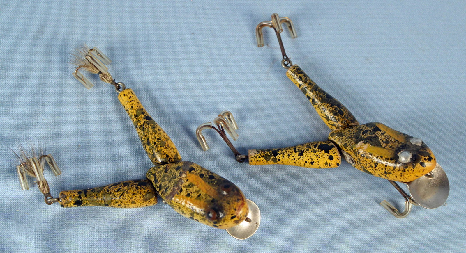 Paw Paw Wotta Frog Fishing Lures: Paw Paw Wotta Frog Fishing Lures. (1) Frog lure body measures approx. 3 1/4" long. Silver bill marked, "Paw Paw." (1) Frog lure body measures approx. 3 1/2" long. Silver bill marked, "Paw Paw." Condit