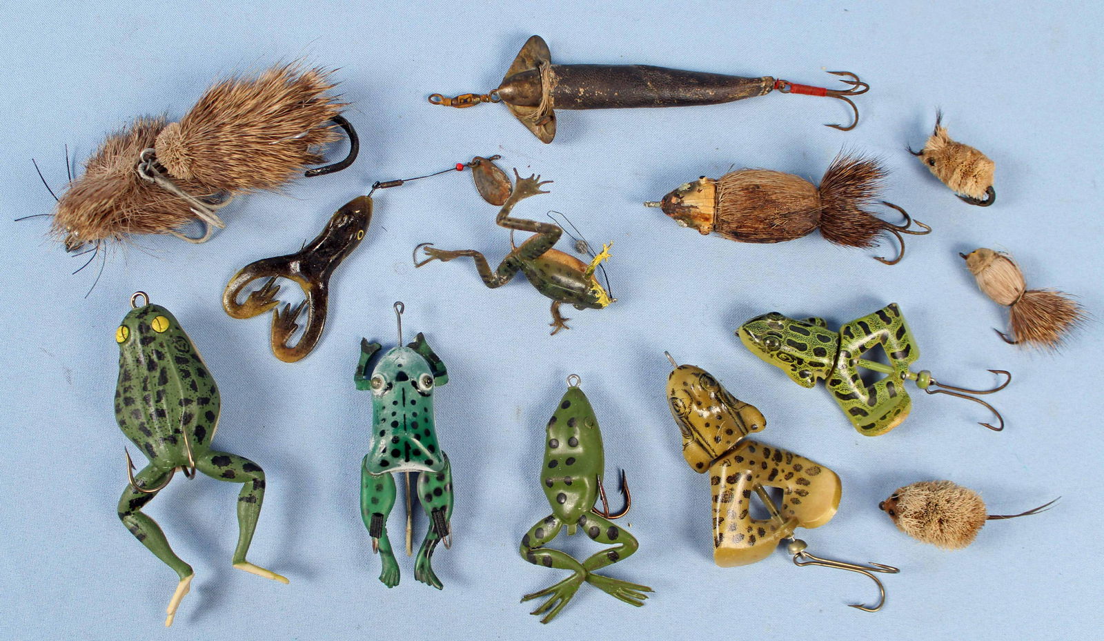 Group of Frog and Natural Hair Fishing Lures: Group of Antique and Vintage Frog and Natural Hair Fishing Lures. This group includes a Paw Paw natural hair mouse and a 4" leather body minnow lure with a brass spinner head. Condition - Paw Paw natu