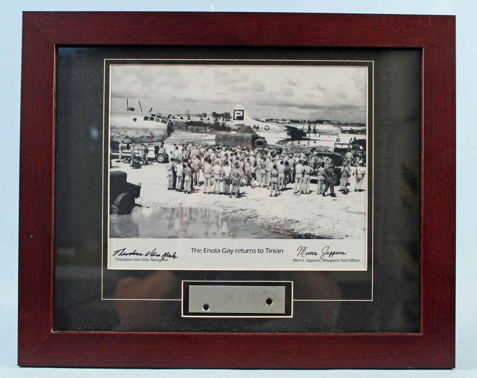 The Enola Gay Returns to Tinian Print Sgd by Crew: The Enola Gay Returns to Tinian Print Signed by Two Crew Members. This print comes with a piece of the of B-29 skin relic. A certificate of authenticity is affixed to the verso of the print from Dutch