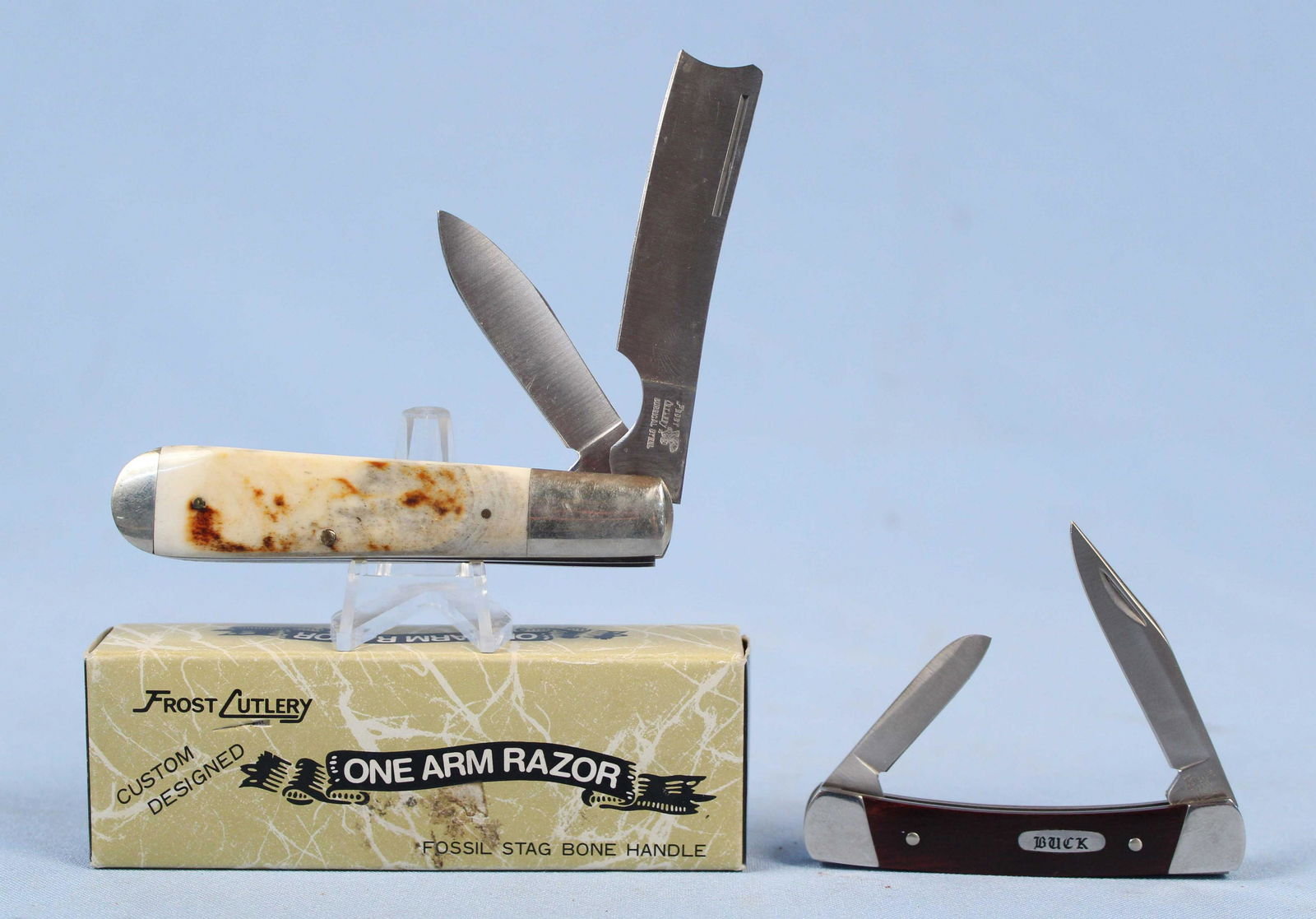 Frost One Arm Razor & Buck 709 Pocket Knives: Frost One Arm Razor & Buck 709 Pocket Knives. (1) Frost One Arm Razor Two Blade Pocket Knife with Fossil Stag Bone Handle and Original Box. Made in Japan. Closed the knife measures 3 3/4" long. (1) Bu