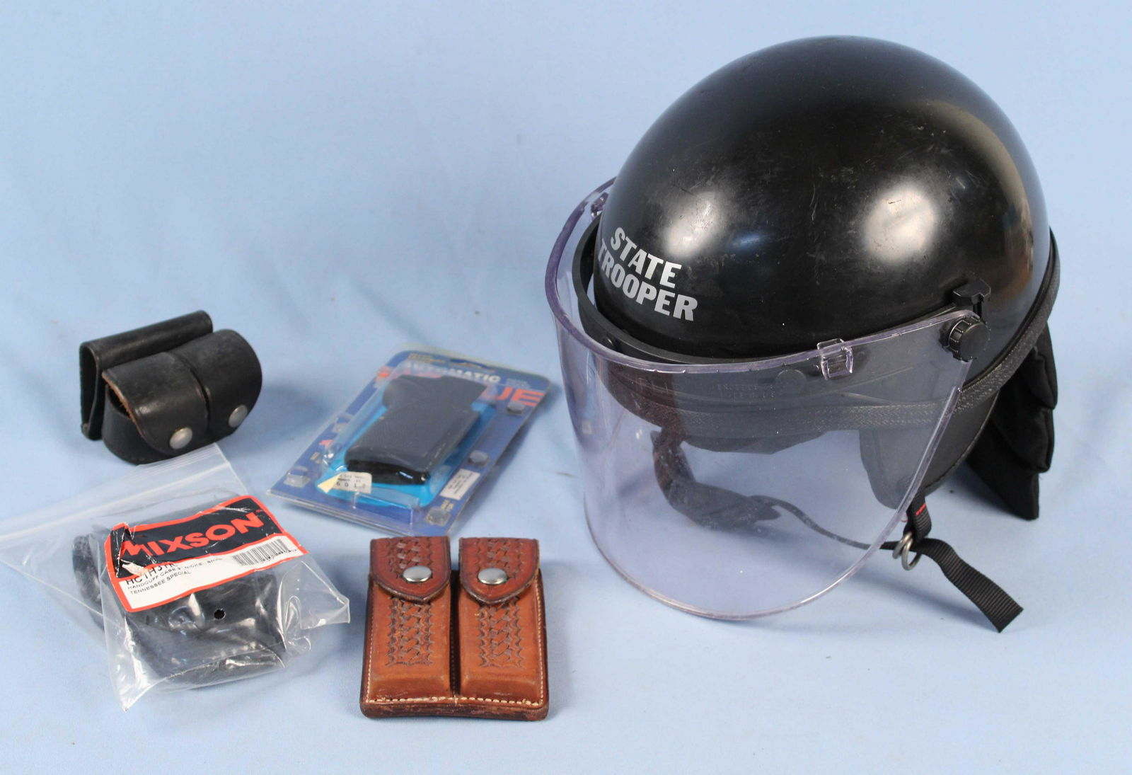 TN Riot Helmet, Handcuffs, Carriers, & Grip: TN Riot Helmet, Handcuffs, Carriers, and Grip. (1) Safariland S&W 39 .45 auto double magazine carriers. (1) Safariland 340-1 double speed loader pouch (does not have speed loaders). (1) Hogue S&W 3rd