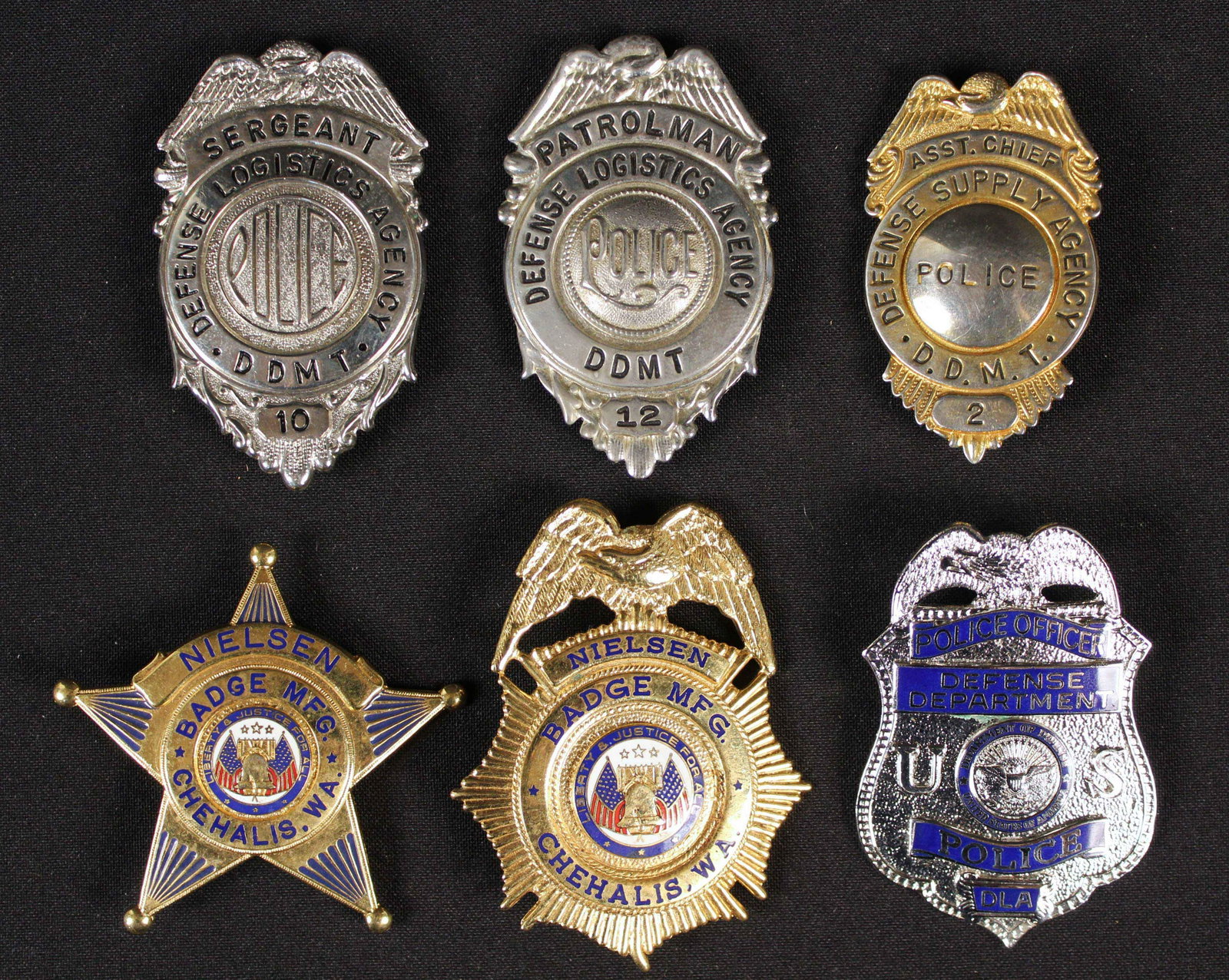 Six Police, Patrolman, Sergeant Badges: Six Police, Patrolman, Sergeant Badges. (1) Department of Defense Police Officer Badge. (1) Defense Logistics Agency Sergeant Badge. (1) Defense Supply Agency Asst. Chief Badge. (1) Defense Logistics 
