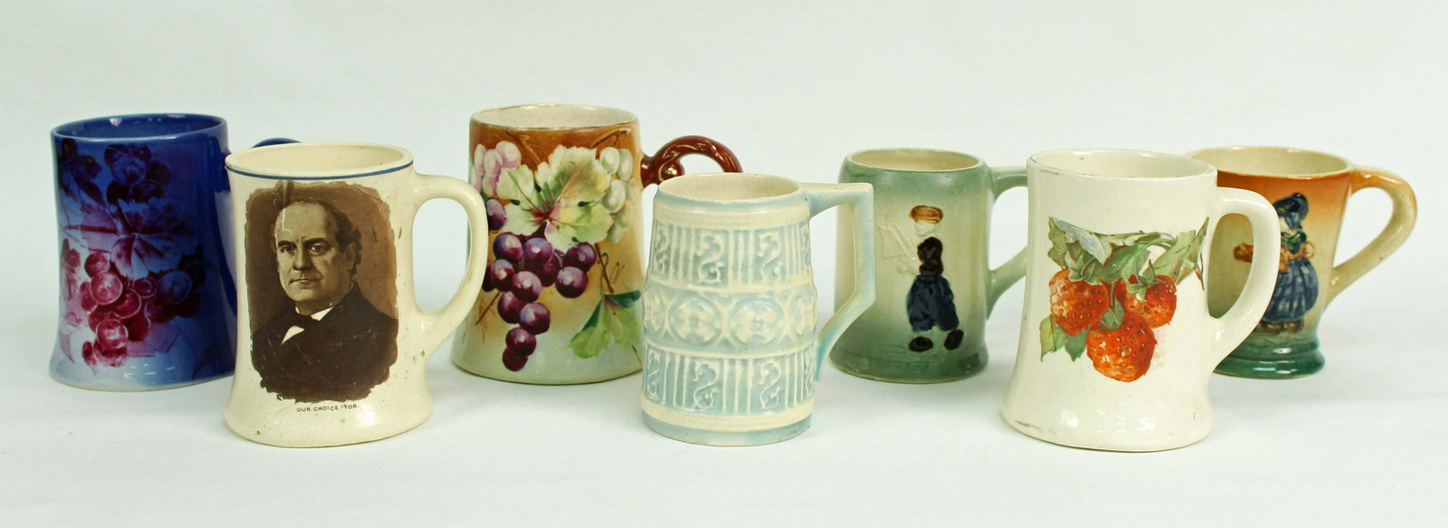 Seven Roseville Pottery Cups and Mugs: Seven Roseville Pottery Cups and Mugs. (1) Light blue and cream mug "Old Ivory or Ivory Tint". Condition - Good condition, no cracks or chips.