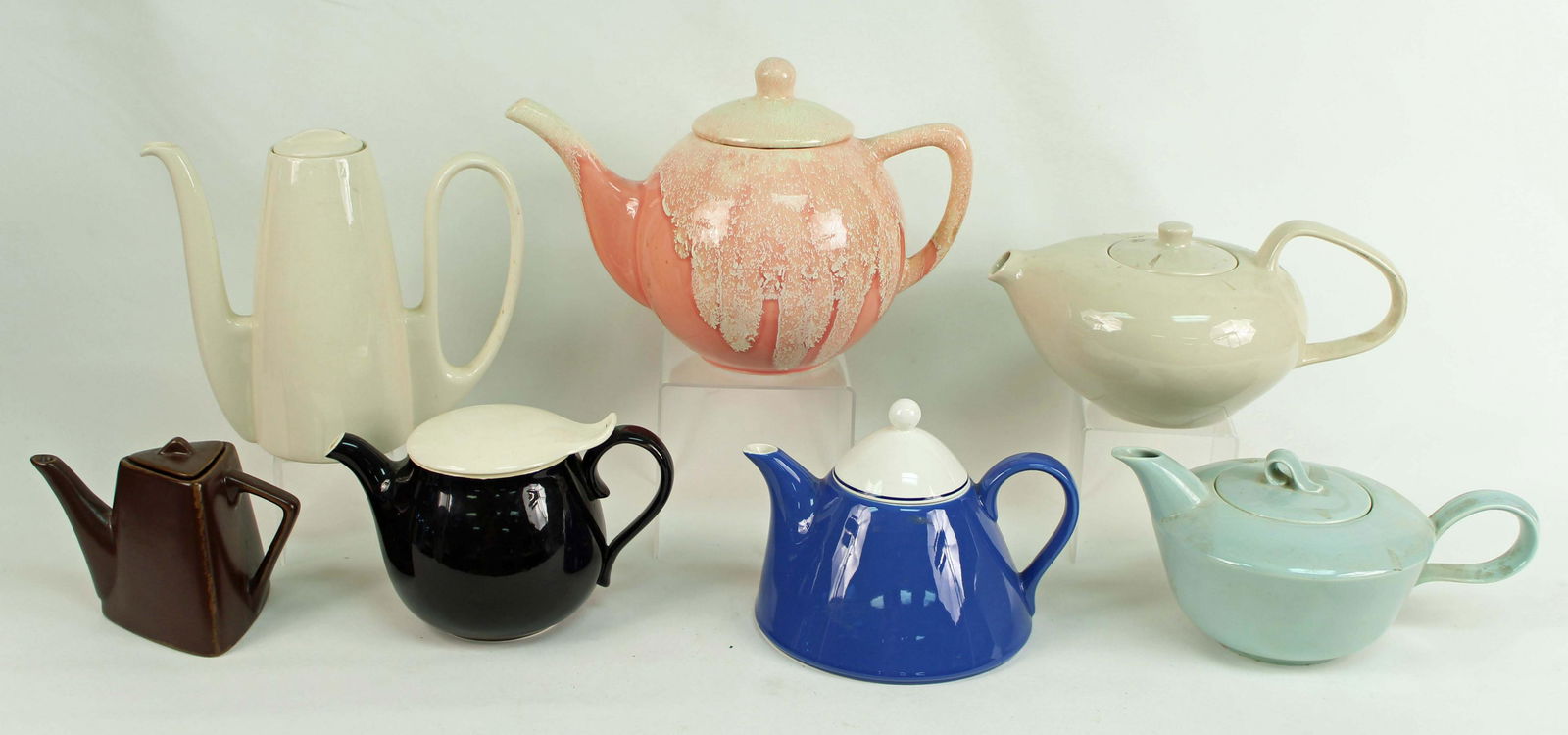 Group of 7 Mid Century & Mid Century Style Teapots: Group of 7 Mid Century & Mid Century Style Teapots. Condition - Six of the teapots are in good condition. The Homer Laughlin "Jubilee" teapot has a small chip on the handle. (See Photos)