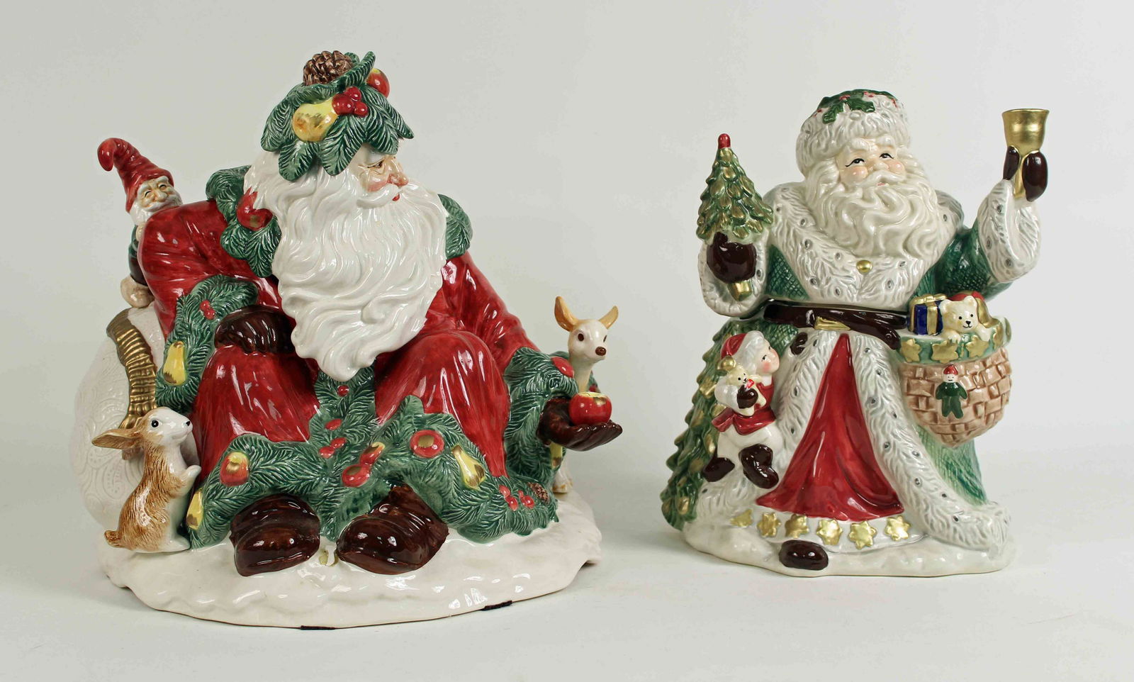 Two Fitz and Floyd Santa Claus Cookie Jars: Two Fitz and Floyd Santa Claus Cookie Jars. (1) Limited Edition Woodland Santa cookie jar. Santa is surrounded by woodland animals, elf, fruit, etc. Measures approx. 13" high x 13" x 15". (1) Snowy Wo