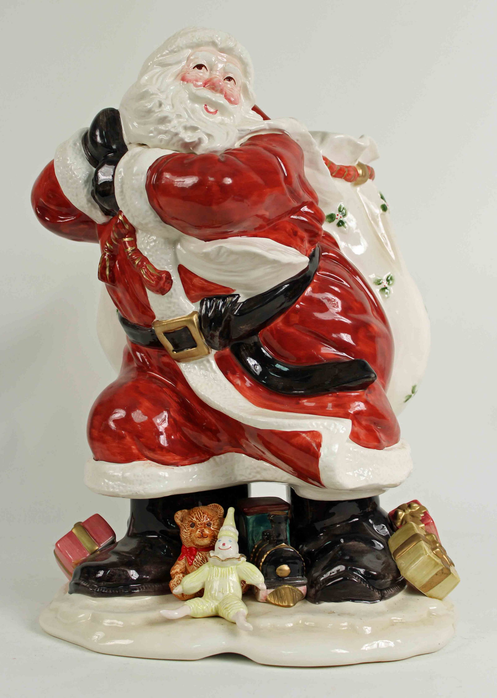 Fitz & Floyd Santa Claus w/ Toy Sack Vase: Fitz & Floyd Santa Claus with Toy Sack Vase. Base is covered with toys and presents. Measures 16 1/2" high. Condition- Vase is in good condition. See photos.