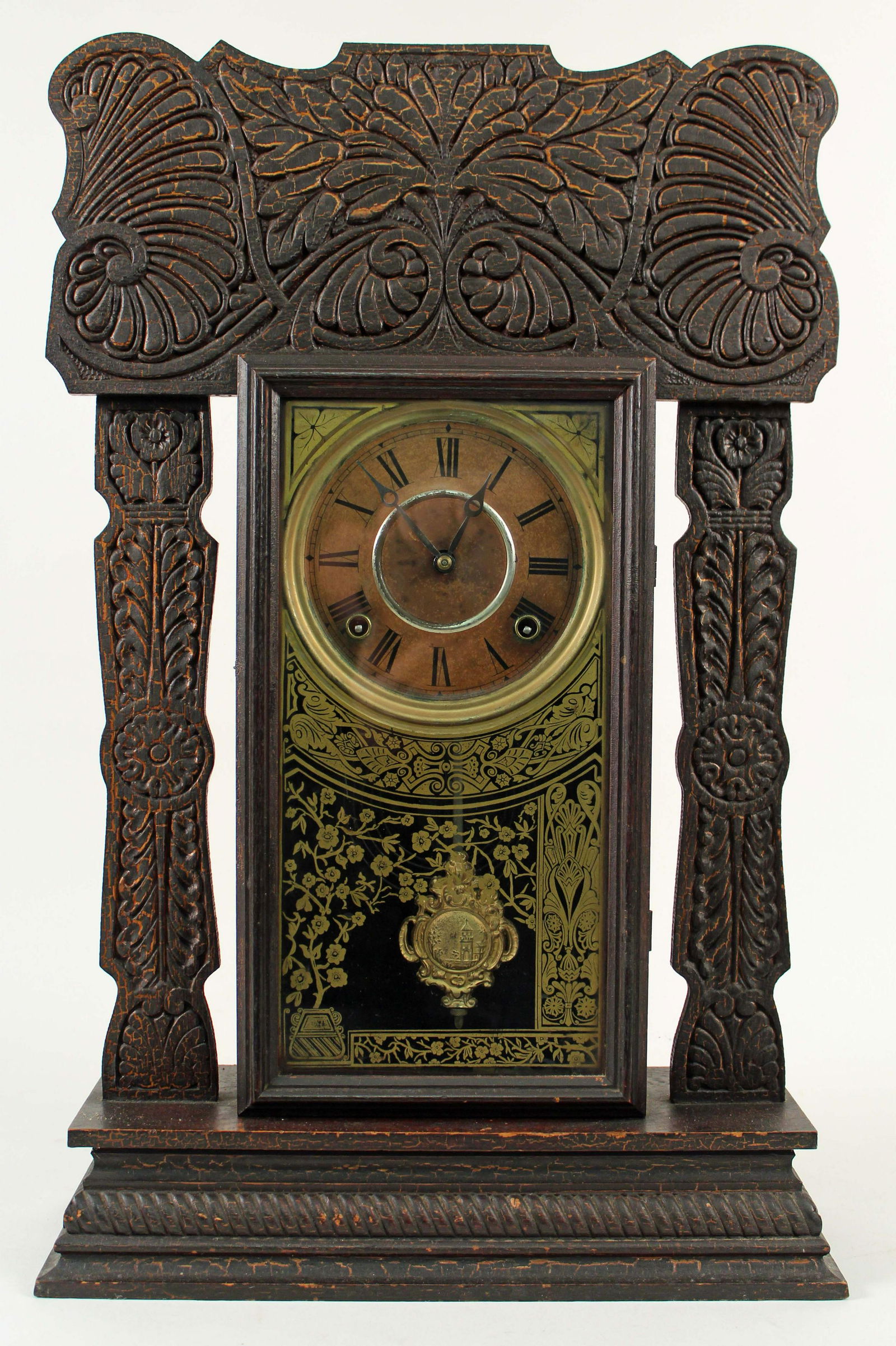 Oak 8 Day Gingerbread Kitchen Clock: Oak 8 Day Gingerbread Kitchen Clock Circa 1910. Clock comes with the pendulum and key. Clock measures 23" H. X 14 1/2" W. X 4 3/4" D. Condition - Original finish with very old crackled paint. Case is